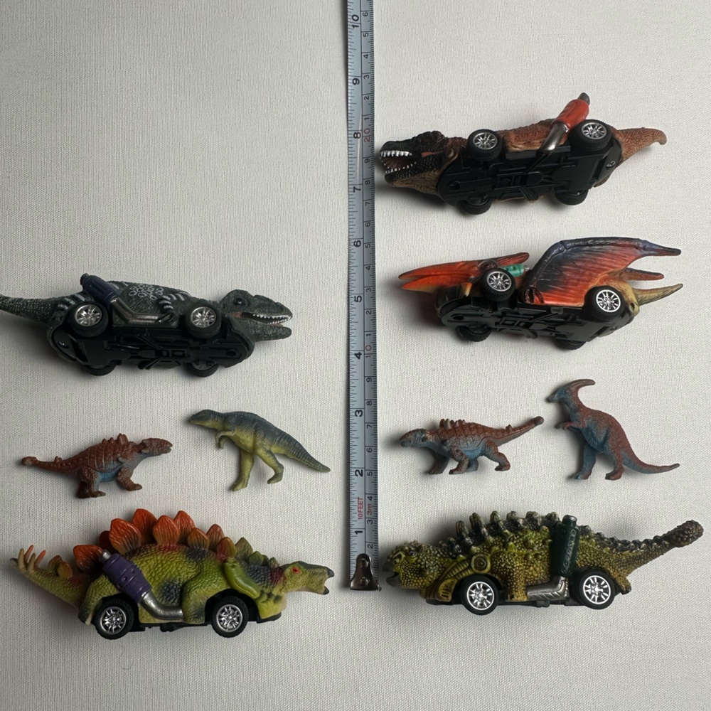 Bundle of multiple sized dinosaurs. 5 are wind up cars. See video.